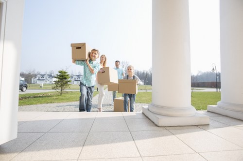 Removal van and moving team in a residential Stroud Green street